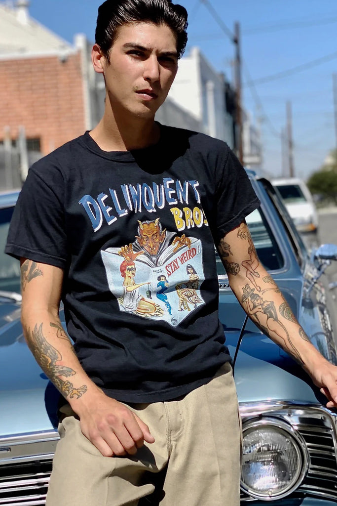 Stay Weird Men's Tee in Black by Delinquent Bros